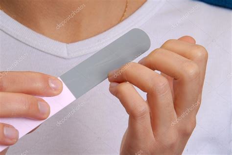 Polishing Fingernails With The Nail File Stock Photo By Gustavo