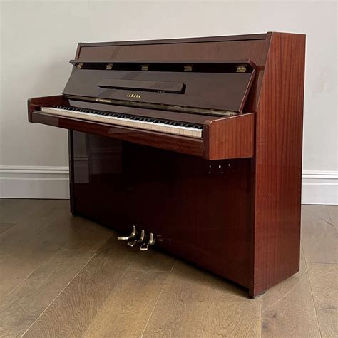 A Yamaha Upright Piano, Mahogany Gloss