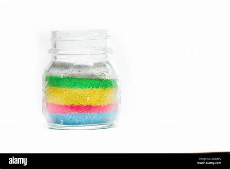 Glass jar with colored sand Stock Photo - Alamy