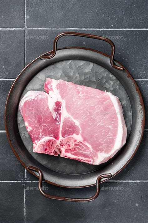 Raw Pork T Bone Chop Meat Steak Black Background Top View Stock Photo