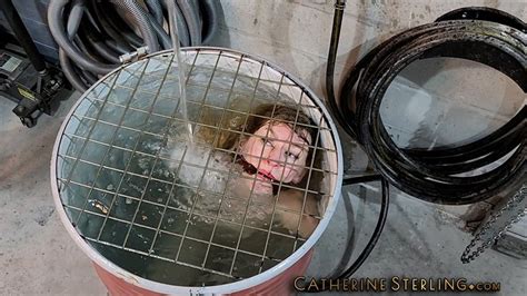 Naked But For Pantyhose Wench With Tiny Tits Is Cleave Gagged Locked In Barrel For A Water B
