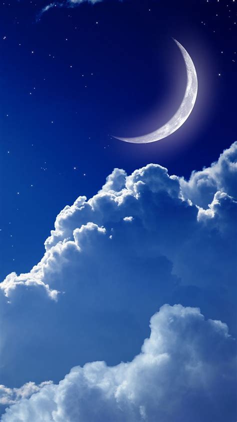 Moonlit Night Sky with Stars and Clouds