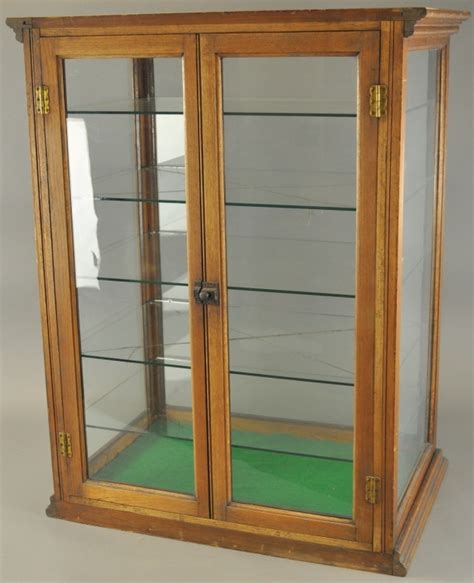 Tall Oak And Glass Display Case 1701800529