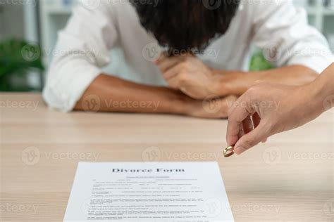 Divorce. Woman remove married ring. Couples desperate and disappointed