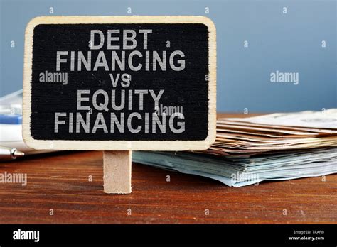 Debt Financing Vs Equity Financing Concept Calculator And Cash Stock