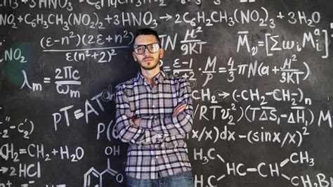 Young Scientist Man Posing in Chemical and Mathematical Equations Wall ...