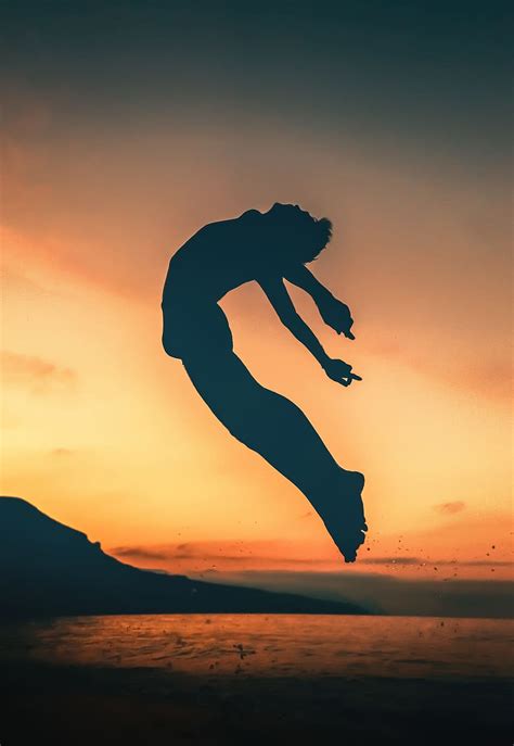 HD Wallpaper Silhouette Of Person Jumping On Seashore Sky Sunset