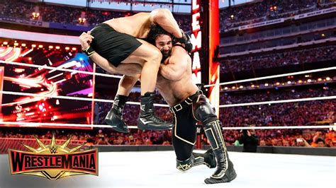 Seth Rollins Goes Low Against Brock Lesnar In Brutal War WrestleMania