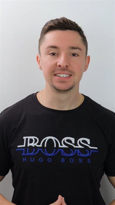 A Man Wearing A Black Shirt With The Word Boss On It