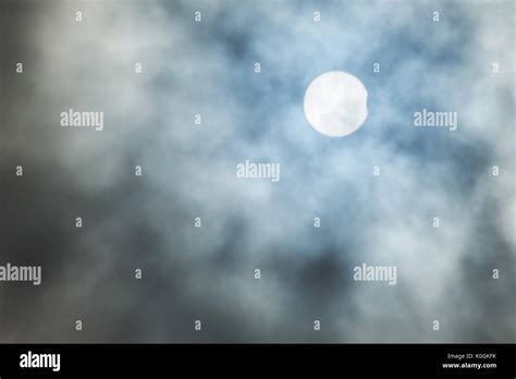 Real Solar Eclipse Background On Cloudy Sky Stock Photo Alamy