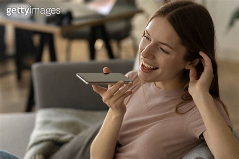 Happy Caucasian Millennial Woman Caller Talking On The Phone At Home In