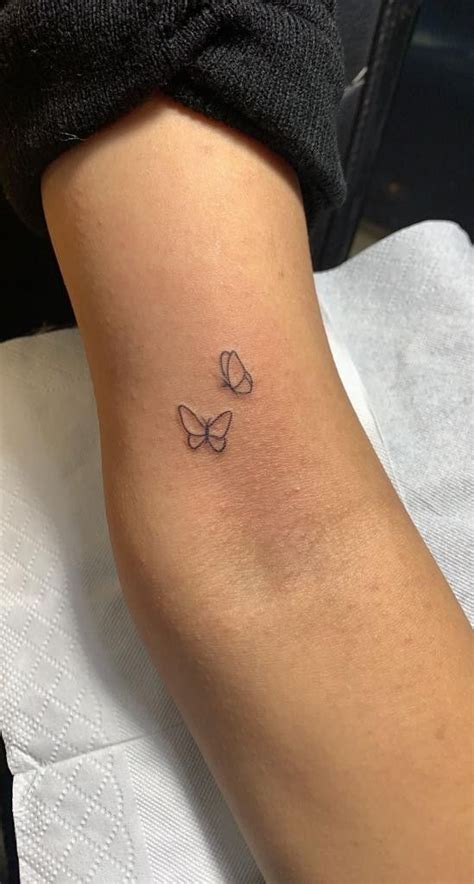 Three Butterfly Tattoo On Woman S Arm