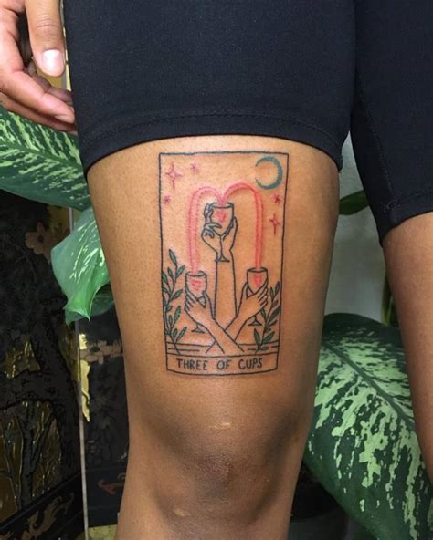 Three Of Cups Tarot Card Tattoo On The Thigh