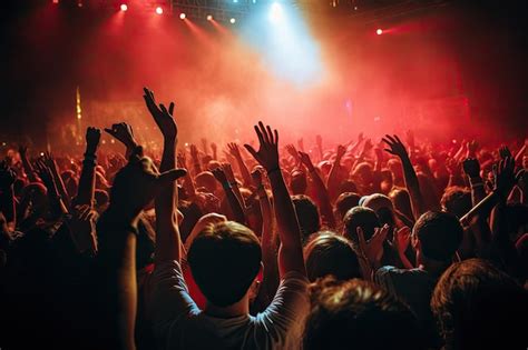 Premium Photo | Crowd at a music festival hands raised up in front of the stage Crowd cheering ...