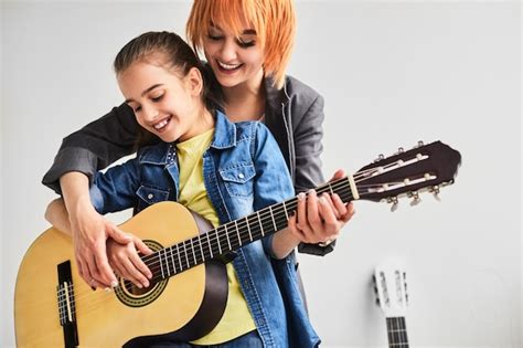 Premium Photo Teacher And Student During Personal Guitar Lesson