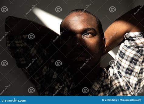 Front Portrait African American Man Glancing In Shadow Stock Image