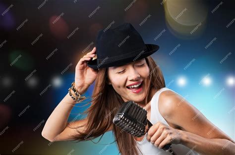 Premium Photo | Female performer at disco with mic