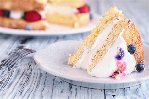 Naked Victoria Sponge Cake With Whipped Cream And Sugared Flowers Stock