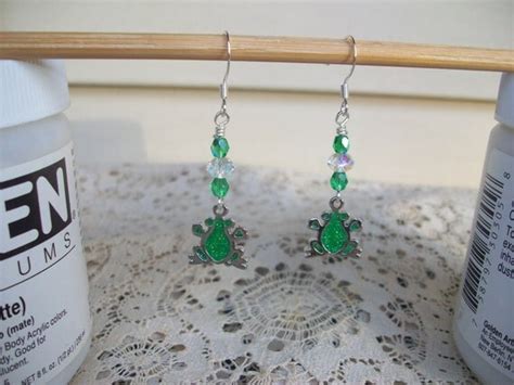 Items similar to Glittered Frog Dangle Earrings on Etsy