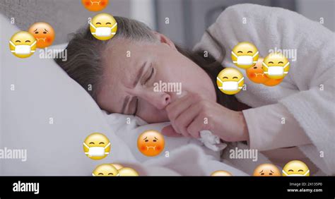 Image Of Falling Emojis Over Woman Using Smartphone Stock Photo Alamy