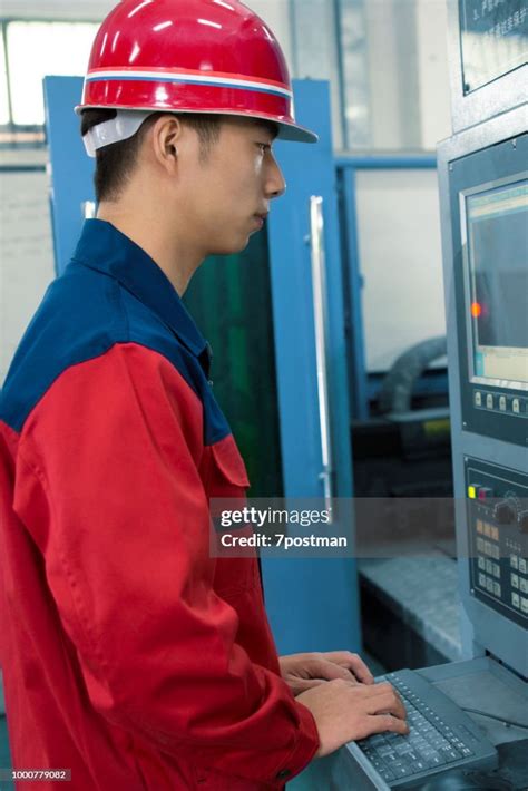 Worker Operating Cnc Machine Center High Res Stock Photo Getty Images