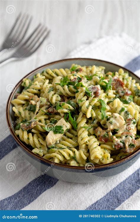 Homemade Chicken Spinach Alfredo Rotini Pasta In A Bowl Side View