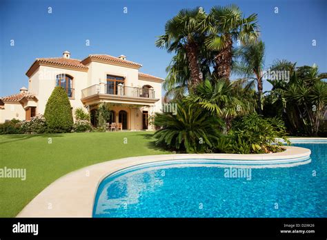 Swimming pool and Spanish villa Stock Photo - Alamy