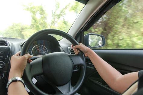 Premium Photo Cropped Hands Holding Steering Wheel While Driving Car