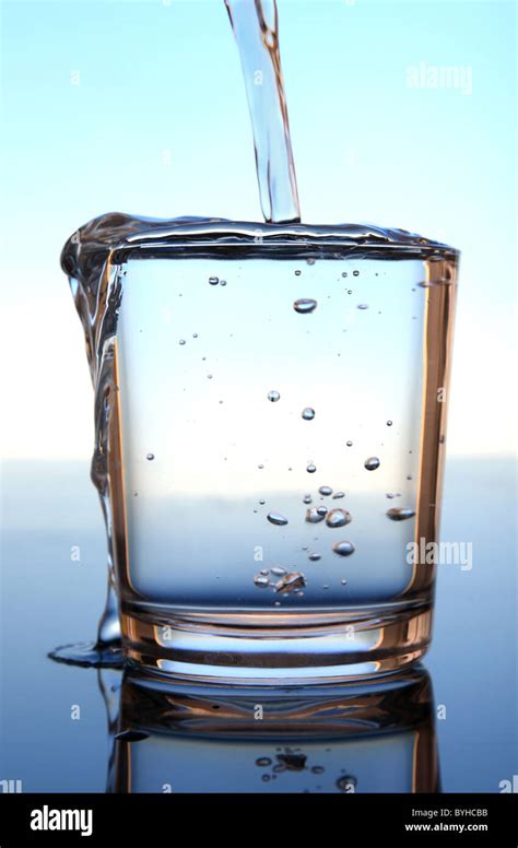 Overflowing Glass Of Fresh Water Stock Photo Alamy