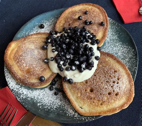 Racuchy with wild blueberries, cream and icing sugar : r/poland