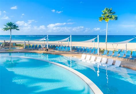 An Empty Swimming Pool Next To The Beach