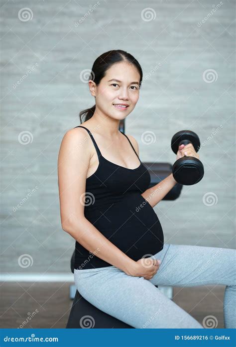 Close Up of Pregnant Woman Exercising with Weights Stock Photo - Image ...