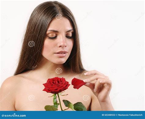 Cute Beautiful Woman Tears Off Petals Of Red Rose On White Background