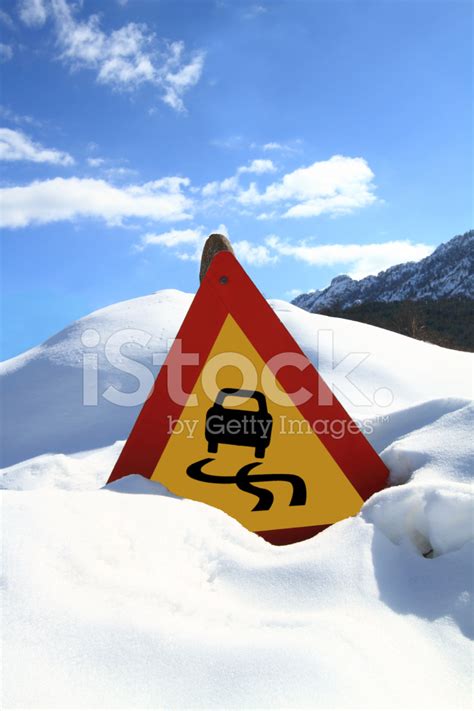 Slippery Road Sign Stock Photo | Royalty-Free | FreeImages