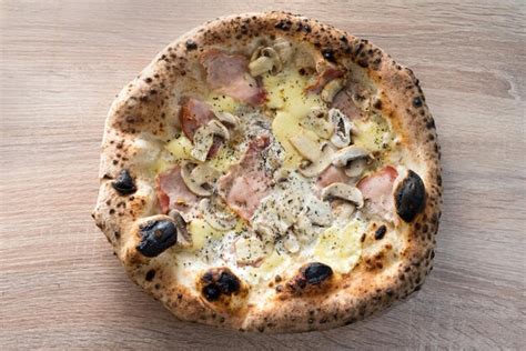 Premium Photo Neapolitan Pizza With Ham Mushrooms And Cheese Baked