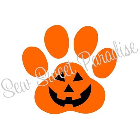 An Orange Paw Print With A Jack O Lantern On It