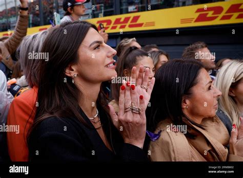 ZANDVOORT, NETHERLANDS - AUGUST 27: Sophie Kumpen claps her son Max Verstappen of Oracle Red ...