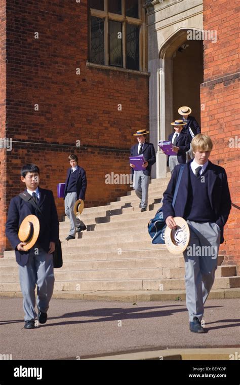 Harrow on the Hill , Harrow School pupils or students in uniform walking in grounds with ...