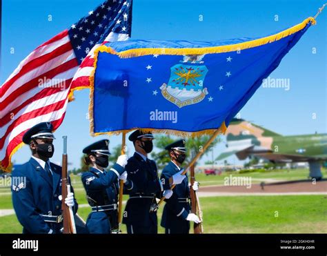 Honor Guard Members Present The American And U S Air Force Flag During