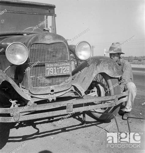 Migrant Worker From Oklahoma Repairing Tire On California Highway 1936