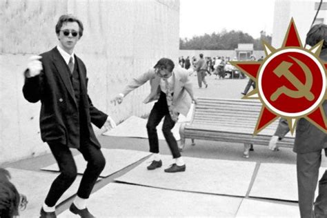 Black And White Photograph Of Men In Front Of A Red Star