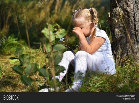 Sad Girl With Flower In Hand