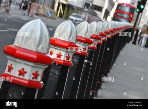 London street bollards and bus, England Stock Photo - Alamy