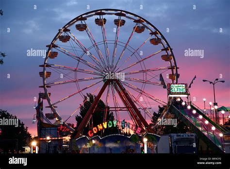 Ferris wheel at sunset Stock Photo - Alamy