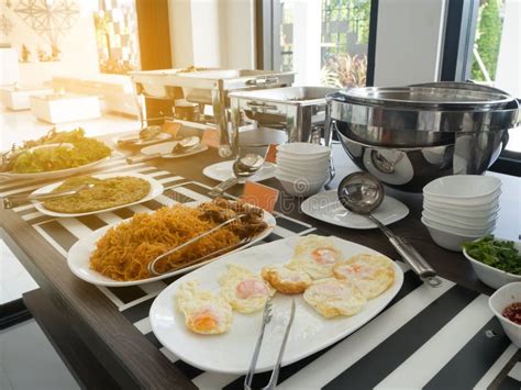 Dinning Table With Variety Of Asian Food At Dinning Room Stock Photo