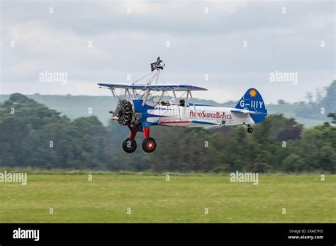 Aerosuperbatics Wingwalkers Display Team Landing At Iwm Duxford After