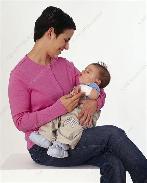 Woman Holding Baby In Her Arms Stock Image C Science