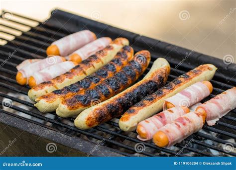 Grilling Sausages On Barbecue Grill Selective Focus Stock Photo