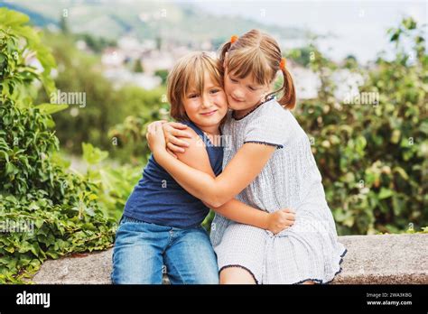 Happy Little Kids Hugging Each Other Brother And Sister Playing