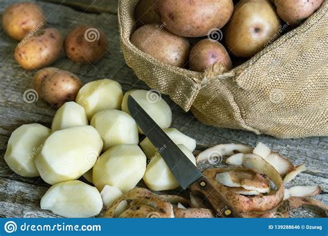 Peeled Potatoes Kitchen Knife Potato Peels And A Burlap Sack Of